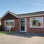 Image of the front of a detached bungalow in Peacehaven | Open House Estate Agents Peacehaven